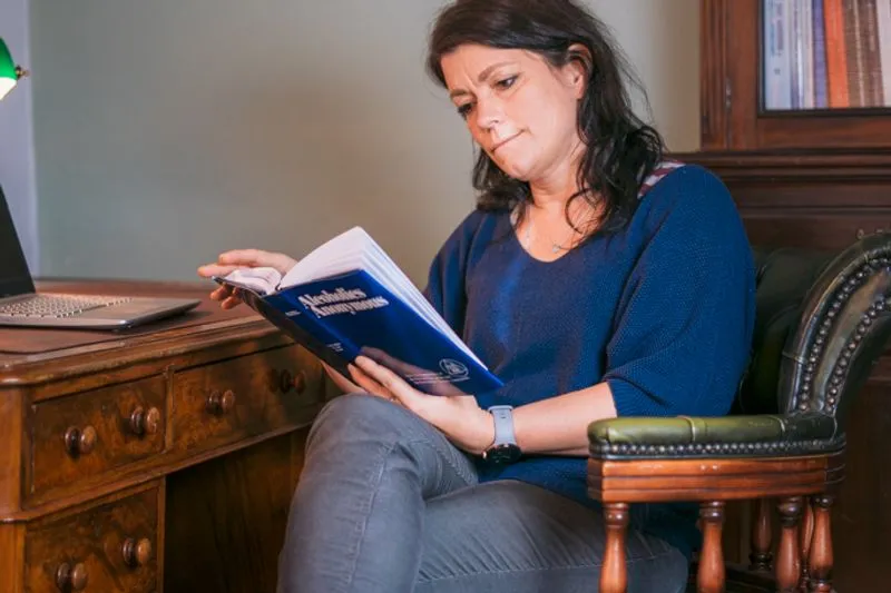 Jakana Rita Therapist for Rehabs UK reading AA's big book